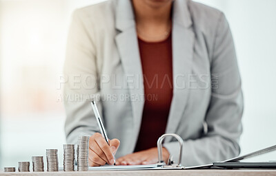 Buy stock photo Bank, coins and hands writing in tax files for financial year or consulting at work desk. Economy, money and accountant working on corporate documents and administration for management.