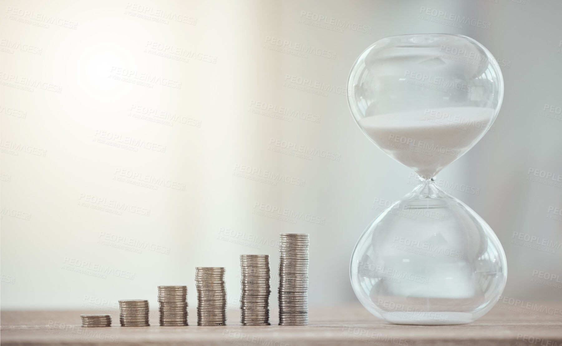 Buy stock photo Cash coins for a future investment with hourglass, savings and growth of finance at the bank. Sand clock countdown for opening of the financial economy market. Money for a corporate business budget.