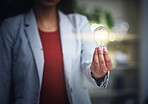 Light bulb, innovation and bright idea with vision, strategy and growth mindset for startup. Closeup hand of leading, thinking and motivated business woman holding lightbulb and showing knowledge
