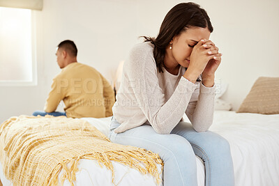 Buy stock photo Uhappy, stressed and cheating while a couple sit on their bed feeling sad, upset and disappointed with sexual issues or communication problems. Heartbroken wife ignoring her partner after an argument