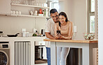 Happy, loving and texting on phone while a young couple stream the internet or social media while bonding at home. Boyfriend and girlfriend showing love and affection while watching together online