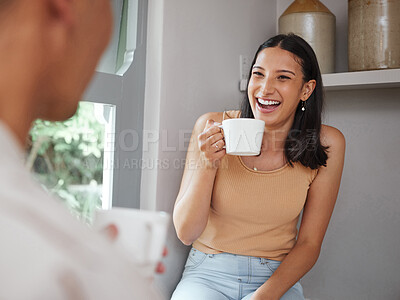 Buy stock photo Happy, carefree and laughing woman drinking coffee in the morning and having fun with her boyfriend at home. Young and excited female laughs at a funny joke while and enjoying time with her partner 