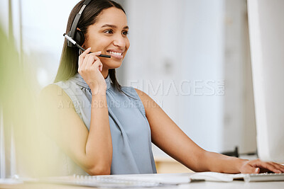 Buy stock photo Call center agent, business consultant or telemarketer assisting client online using headset while typing at computer desk. Contact us for excellent customer service or online faq helpdesk support.