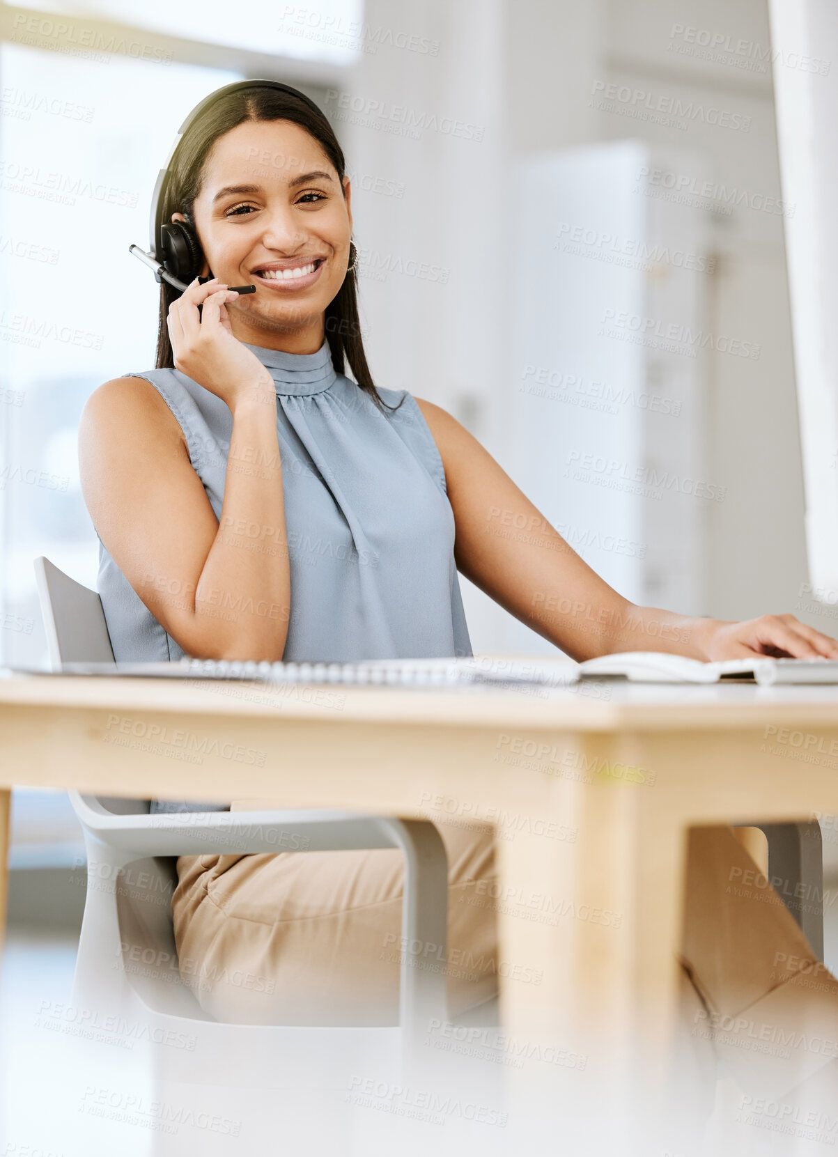 Buy stock photo Call center agent giving advice, helping clients with headset and networking on a desktop computer in an office at work. Portrait of a smiling customer service agent talking, discussing and planning