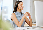 Happy, smiling and friendly call center agent giving good customer service, sales support and help when working on computer. Confident operator and cheerful consultant with headset talking on hotline