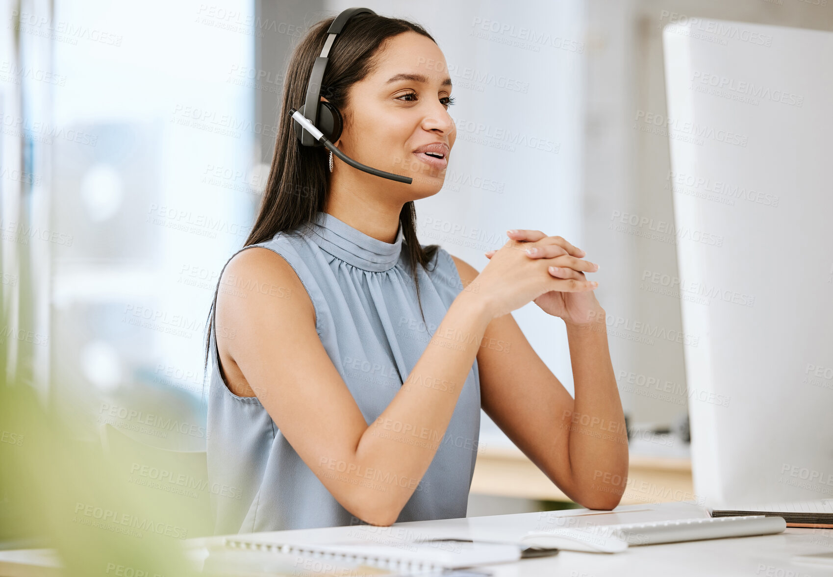 Buy stock photo Call center agent, customer service and sales support operator with headset giving friendly help and good advice while working on computer. Smiling, happy and cheerful consultant talking on hotline