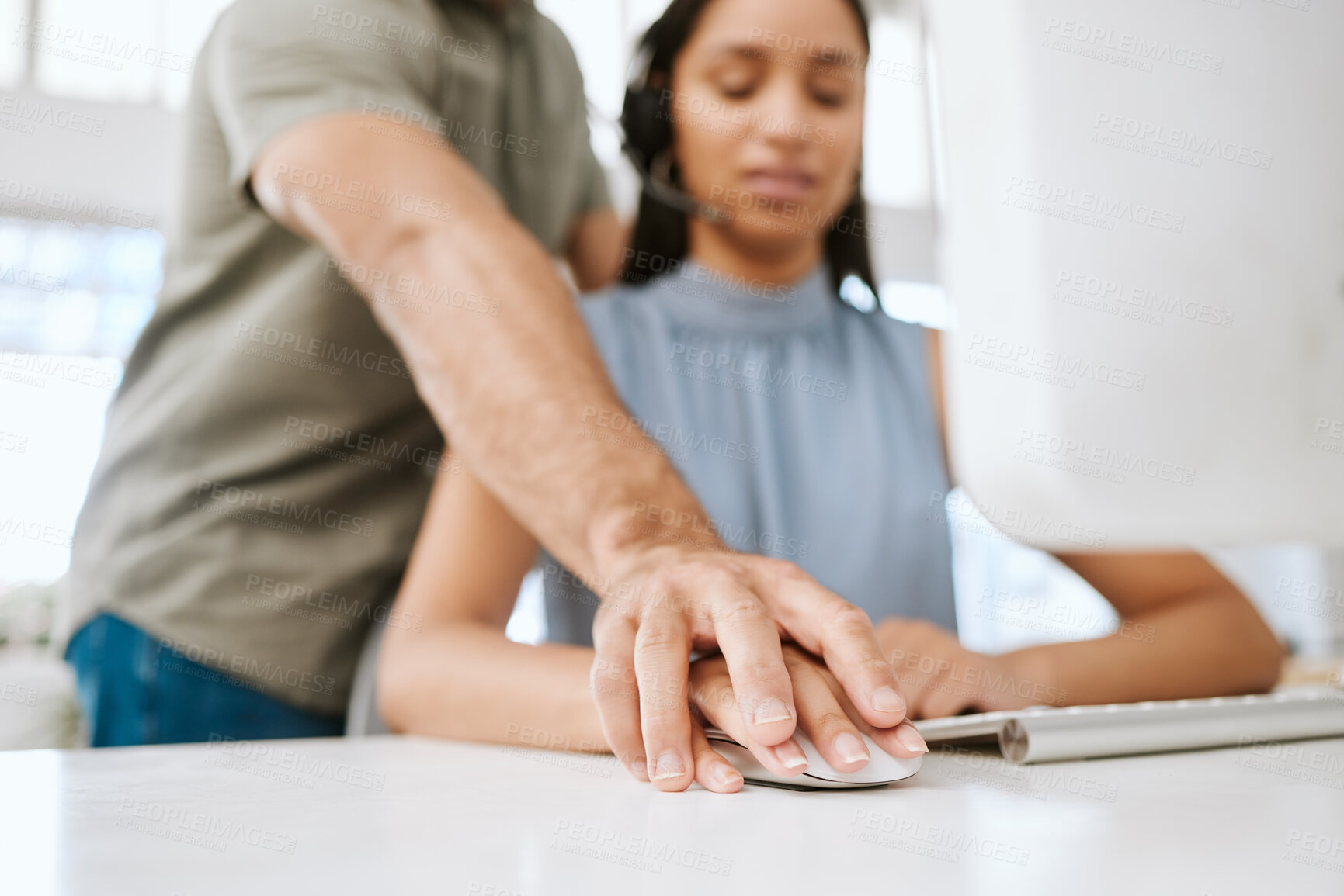 Buy stock photo Sexual harassment or abuse by a business man of a female employee by putting his hand on hers. Unhappy and scared female coworker feeling uncomfortable due to inappropriate touching in the office