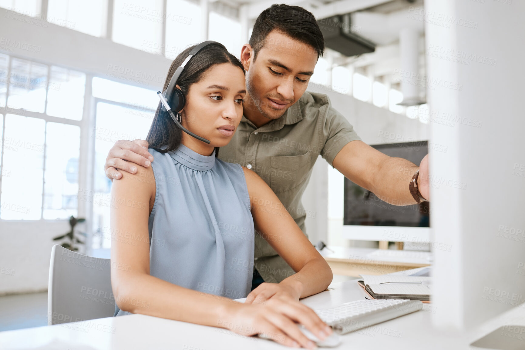 Buy stock photo Office sexual harassment, abuse and inappropriate behavior from manager, boss and leader touching a call centre agent. Customer service operator feeling uncomfortable by male colleague touching her