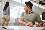 Sexual harassment, desire and suggestive business man in a office looking at a woman from behind. Male worker with provocative desire staring at the body and butt of a female employee walking away