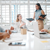 Female leader, manager or boss handing out an information document to ...