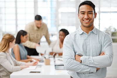 Buy stock photo Smiling, happy and proud young business man with arms crossed showing great leadership to his team in an office. Portrait of a confident entrepreneur satisfied with new opportunity in a startup