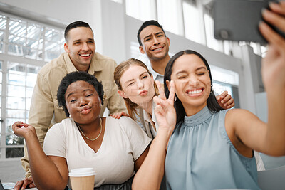 Buy stock photo Fun, goofy or playful team selfie on phone and having fun, goofing around or making silly face expressions. Diverse or cheerful group of business friends or creative colleagues posing on social media