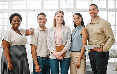 Buy stock photo Happy, smiling and diverse team of business people standing in unity, supporting and working together in a modern office at work. Portrait of workers, employees and colleagues planning a project