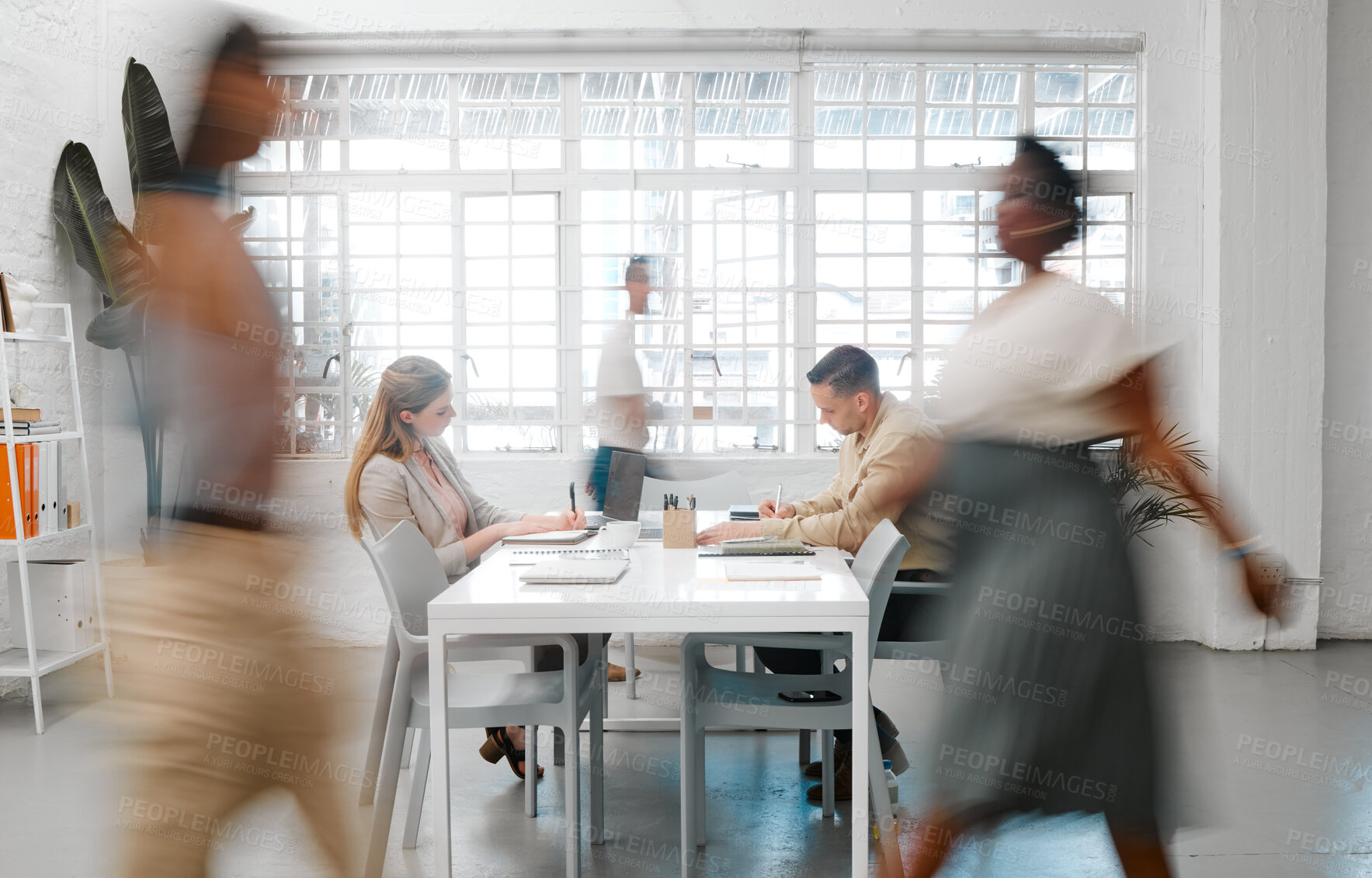 Buy stock photo Blurred designers, marketing or freelance professionals working together in a modern office. Business men and women busy, walking and active in a creative workplace, workstation or environment 
