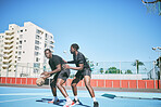 Basketball, sports and game between two sporty male players having fun while playing on a court outdoors. Young black friends training and being active together while competing in a competitive sport