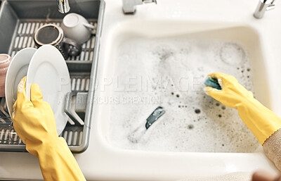 Buy stock photo Housewife, maid or cleaner hands washing dishes in the kitchen sink for home hygiene, wearing rubber gloves. Contact us for cleaning solutions or professional domestic household chores service.