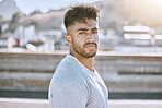 Fitness, wellness and healthy personal trainer portrait for workout, training or exercise routine in the city. Cool, tough and young man or guy with determined face for motivation or training goal
