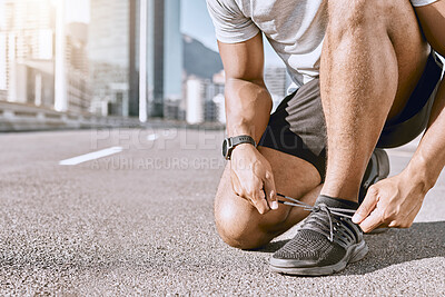 Buy stock photo Runner getting ready for fitness running in city street, cardio training workout in town and preparing for exercise in road downtown. Active male jogging, exercising and doing physical activity