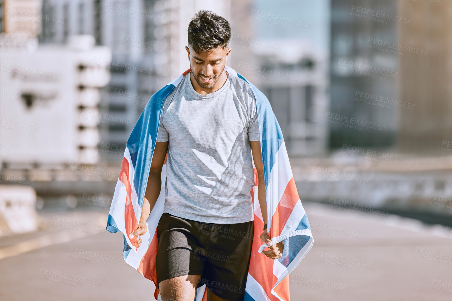 Buy stock photo Fitness, training and workout with a sports man in a british flag running a marathon in the city. Health, exercise and wellness with an olympic athlete or runner exercising for cardio and endurance