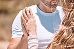 Closeup of an engaged couple holding hands showing their romance, love and care. Caucasian man and woman after a sweet, romantic and special proposal. Lady showing off her beautiful engagement ring.