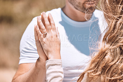 Buy stock photo Closeup of an engaged couple holding hands showing their romance, love and care. Caucasian man and woman after a sweet, romantic and special proposal. Lady showing off her beautiful engagement ring.