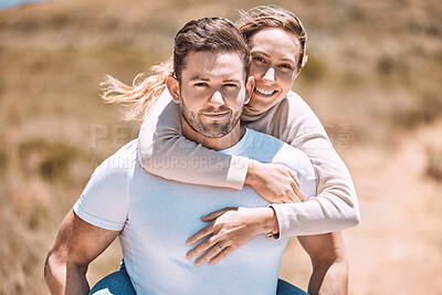 Buy stock photo Playful and playing piggyback couple smiling, bonding  and enjoying outdoors in summer or spring. In love, dating and in relationship partners playing and having fun on a romantic date together.