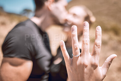 Buy stock photo Engagement, proposal and romance while showing off her diamond ring and saying yes to marriage outside. Closeup hand of a young romantic couple telling you to save the date for their wedding day
