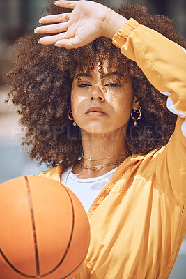 Buy stock photo Serious basketball player playing ball for fitness training, doing wellness exercise and sport workout on the court. Active black woman exercising, looking confident and getting ready to play sports