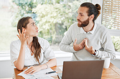 Buy stock photo Stress, finance and arguing couple talking about budget, home loan and bills while sitting with tax papers and laptop . Man and woman with problem upset about bad financial debt and mortgage payment