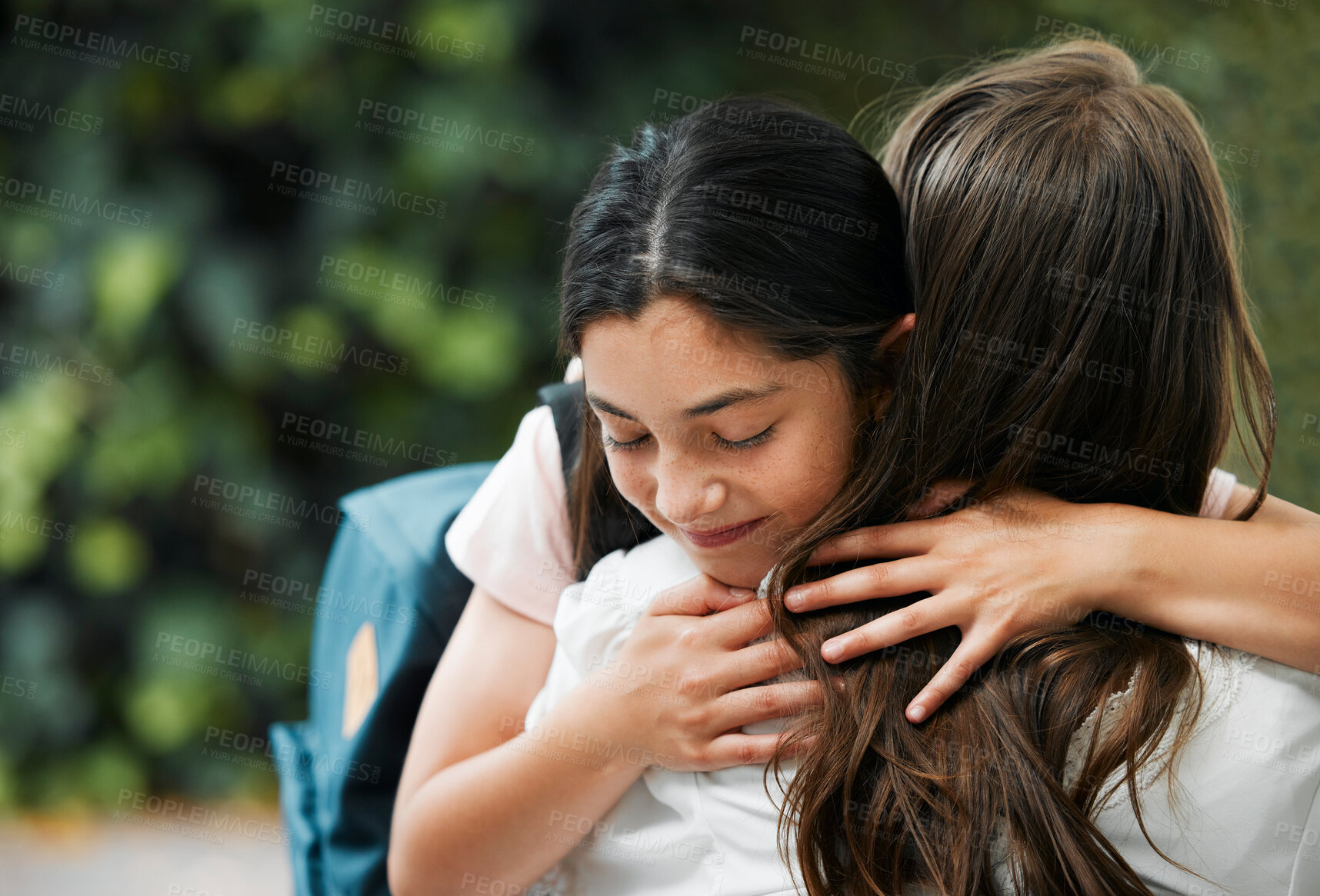 Buy stock photo Family hugging on first day of school, mother greeting girl and giving embrace before school education in the morning. Mom and kid hugging at park, holding and showing affection before leaving 