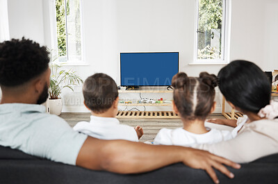 Buy stock photo Watching tv or streaming a subscription service with green screen and chromakey together as a family at home. Rearview of mother, father and children getting ready to watch a movie or series