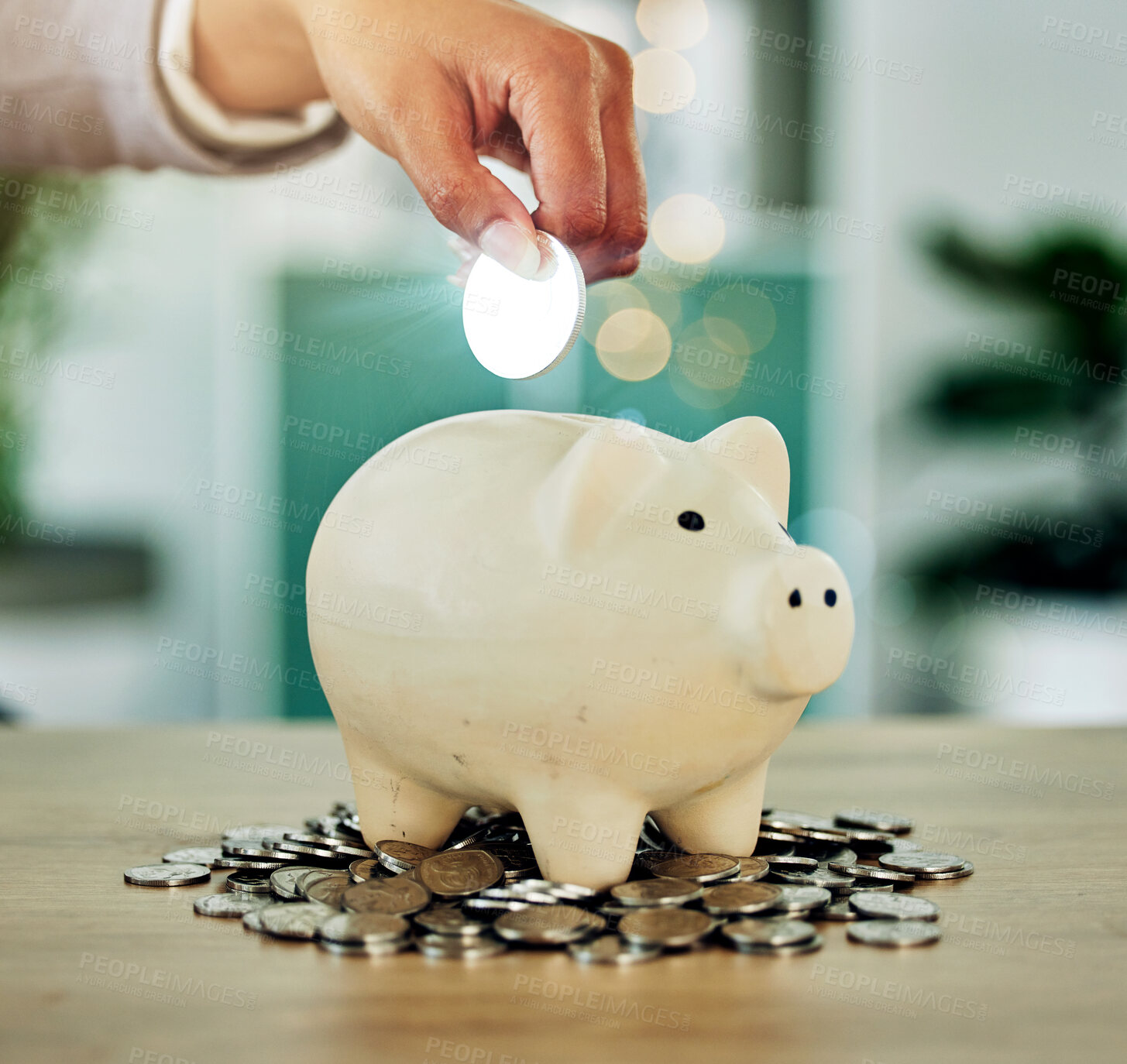 Buy stock photo Investment, savings and growth hand with silver coin in a piggy bank investing in future wealth or financial development. Finance person invest or saving change, money or cash in overflowing jar