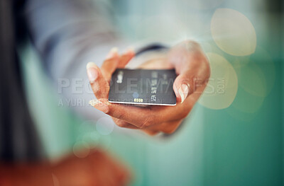 Buy stock photo Female hand holding a credit card to pay her debt, loans and mortgage at the bank during inflation. Closeup of a woman paying her financial bills. Lady making an investment in savings account.