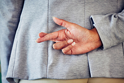 Buy stock photo Hand gesture, sign or icon of a liar not telling the truth and being dishonest. Female waiting for good news and holding a sign. Woman crossing fingers for good luck, hope or a lie, behind her back.