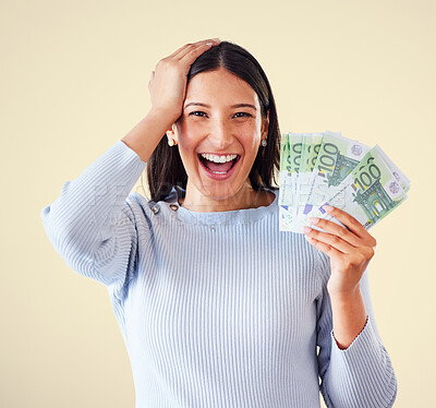 Buy stock photo Woman celebrating success, winning money or lottery victory, holding cash or banknotes in hand. Portrait of excited, happy and proud winner screaming and laughing, with yellow copyspace background.