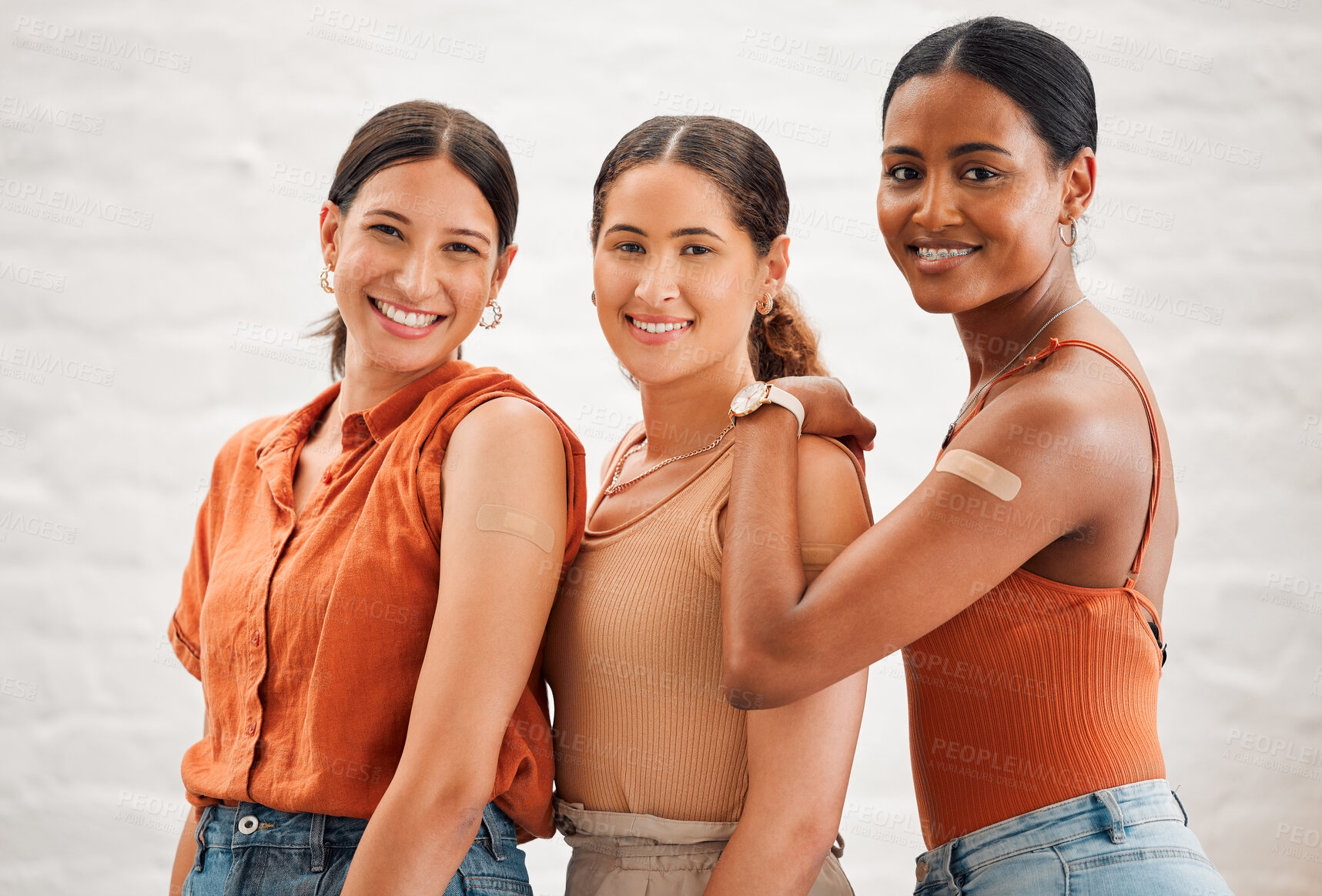 Buy stock photo Covid vaccination or flu shot inside of girl friends, female friendship and teenagers smiling. Portrait of a happy and diverse friend group standing and practicing good health habits together