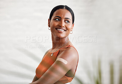 Buy stock photo Covid vaccine, safety and health with plaster after vaccination for business protocol or policy and protection against the virus. Smiling female worker showing her arm after injection