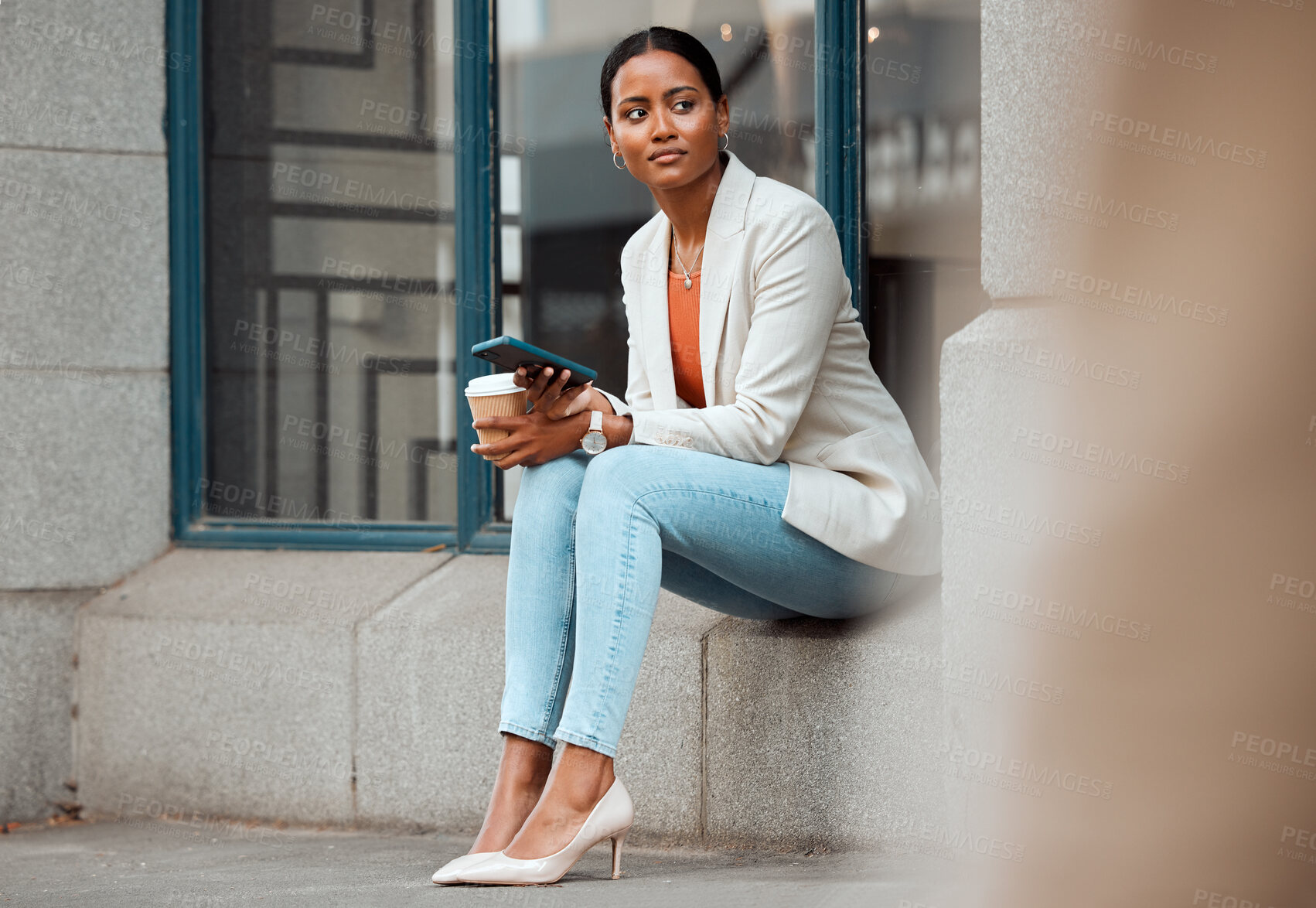 Buy stock photo Phone, waiting and coffee break with a young startup entrepreneur or creative designer sitting outside in the city. Business woman looking away, thinking about the future and enjoying a drink