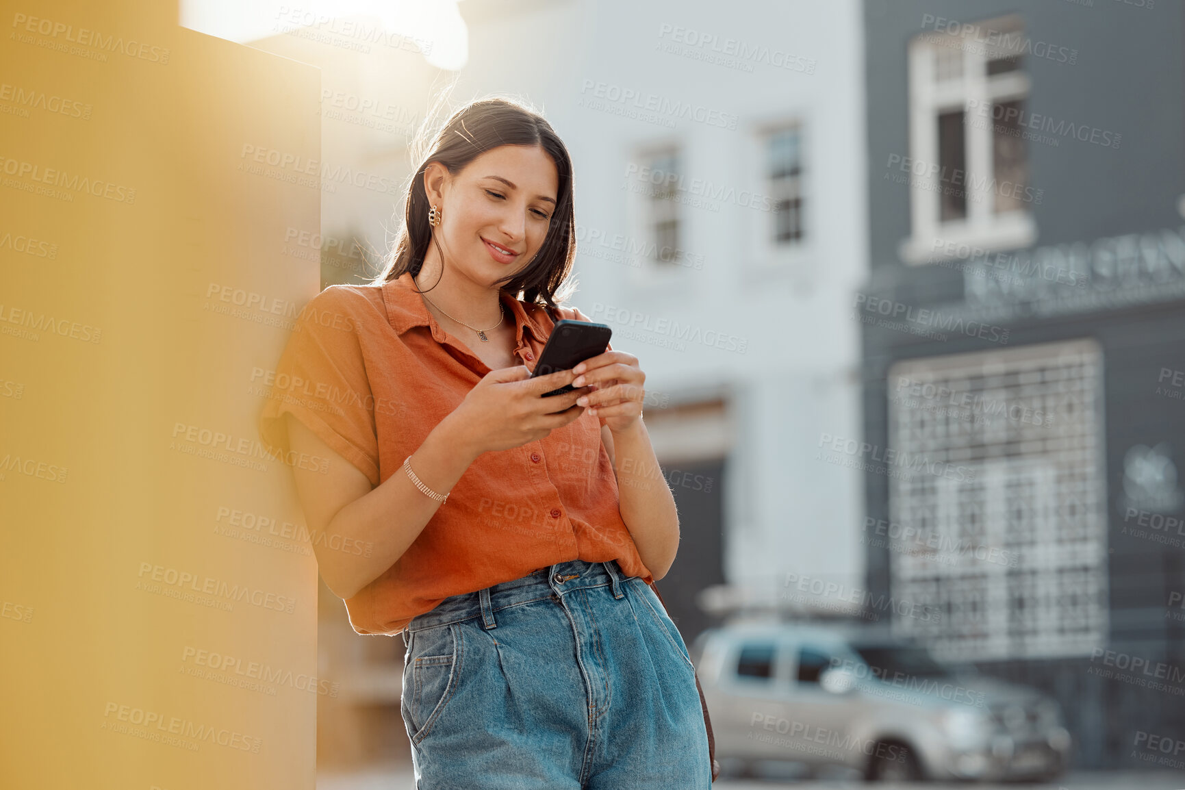 Buy stock photo Texting on a phone, waiting for public transport and commuting in the city with a young female tourist enjoying travel and sightseeing. Looking online for places to see and visit while on holiday