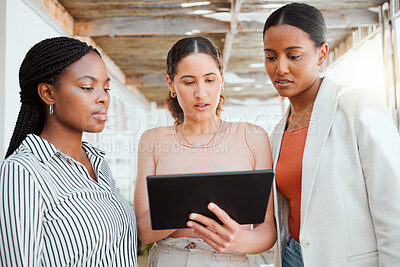 Buy stock photo Collaboration, teamwork and working team with a tablet looking at digital data together. Group of female business office workers thinking and reading online web information planning a project outside