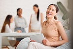 Businesswoman, team leader or manager on a tablet working at a female only company or women empowerment workplace with colleagues in background. Corporate professional with business success portrait