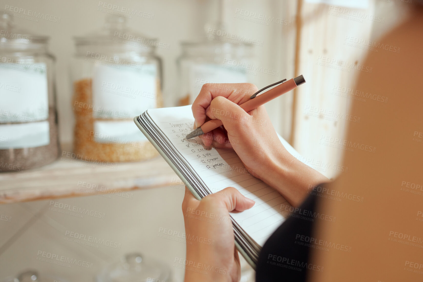Buy stock photo Entrepreneur stock counting and writing or planning shopping list in a store on a notepad. Small business owner making a budget for inventory and restocking of supplies in local store, shop or cafe