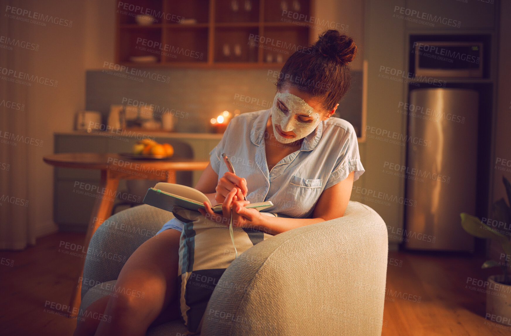 Buy stock photo Selfcare, grooming and creative writing by a woman making notes in diary while giving herself a facial. Relaxed female planning ideas for a novel in a journal, enjoying free time and a calming hobby