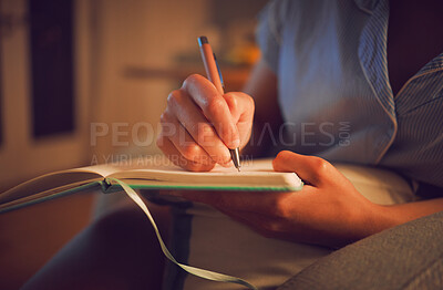 Buy stock photo Creative writing at home by female hands enjoying a calm, peaceful day off indoors. Woman making notes in a journal, expressing her feelings and thoughts while making a note of a personal experience