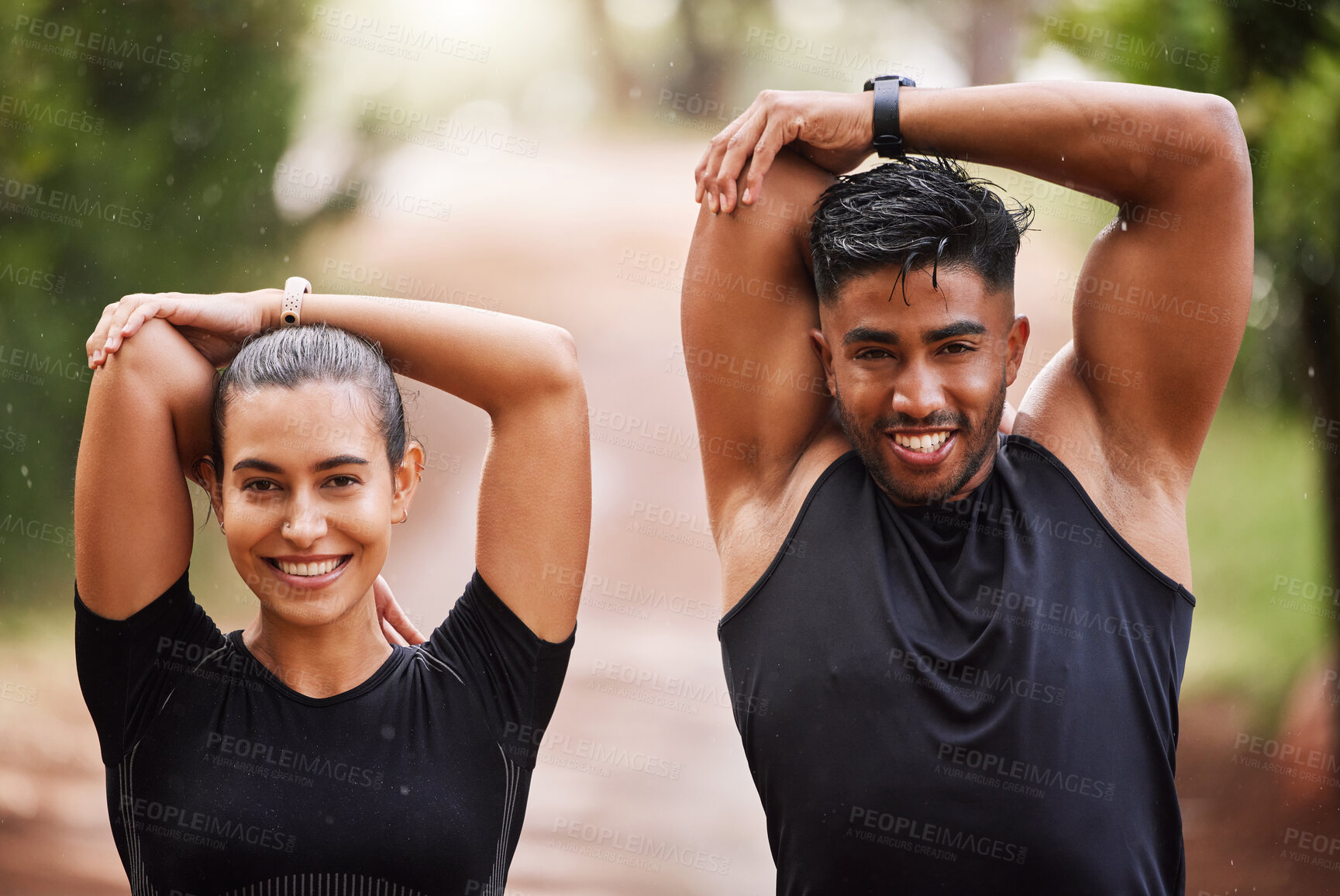 Buy stock photo Healthy, fit and motivated couple stretching, warming up or training together in green park with bokeh background. Faces of athletic man and woman preparing for endurance workout, warmup or exercise