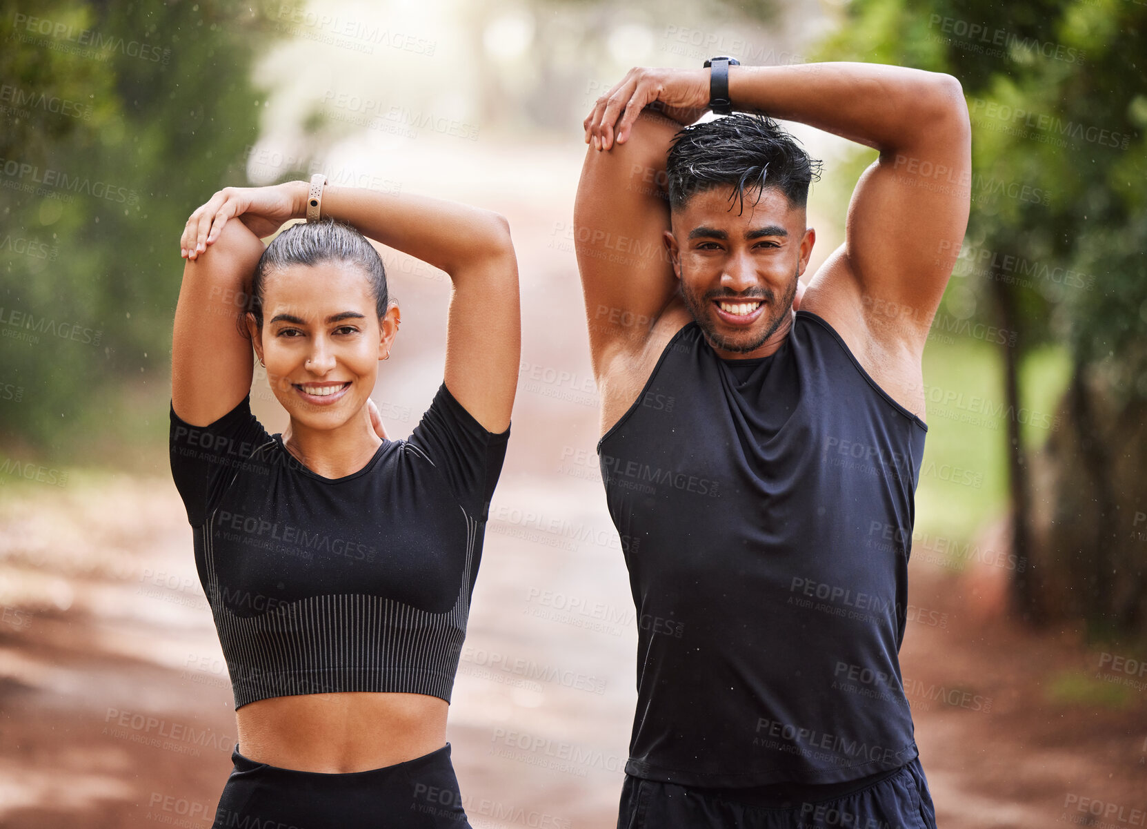 Buy stock photo Fit couple or active, athlete friends stretching arms for exercise warmup outdoors in forest. Workout partners or smiling joggers about to run or do cardio training for health and wellness lifestyle.