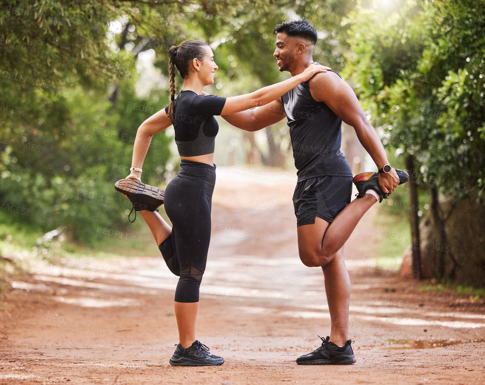 Buy stock photo Fitness, active and healthy couple stretching, exercising or training together outside park. Sporty and supportive man and woman preparing for workout exercise, warmup routine or jogging in nature