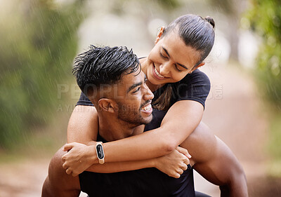 Buy stock photo Wet, fitness couple playing in the rain during fun romantic outdoor training, running or healthy workout exercise in park. Happy sport people with a smile or caring man giving woman a piggyback ride