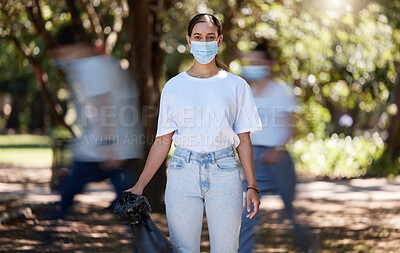 Buy stock photo Woman in covid face mask cleaning the park for clean, hygiene and safe green environment. Responsible activist, volunteer or community service worker with rubbish, trash and garbage in a plastic bag 