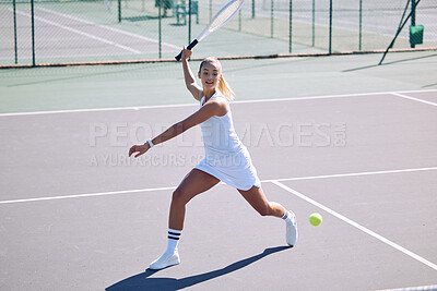 Buy stock photo Fitness, balance and sport with athletic tennis player playing competitive match at a tennis court. Female athlete practicing her aim during a game. Lady enjoying active hobby she's passionate about